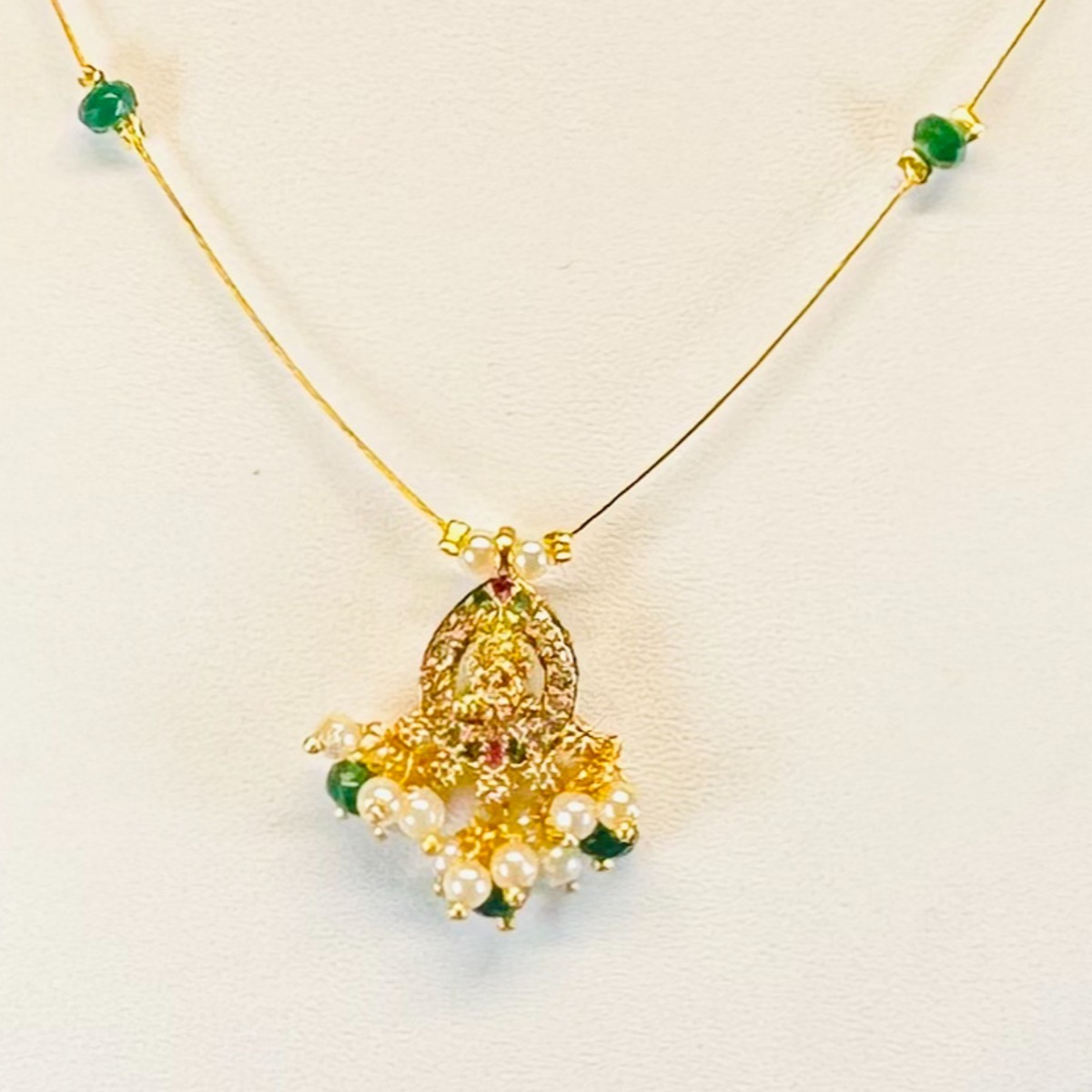 Elegant High Gold Necklace with Temple Pendant